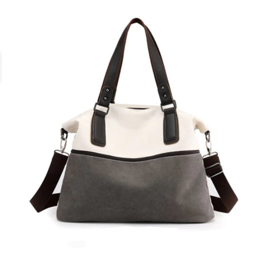 Stor grå lerretsveske med klassisk, tidløst design – perfekt til tur, strand og shopping.