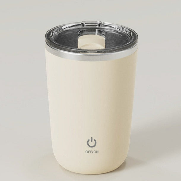 Beige, elektrisk blandingskopp laget av rustfritt stål, designet for effektiv blanding av ingredienser med moderne teknologi.